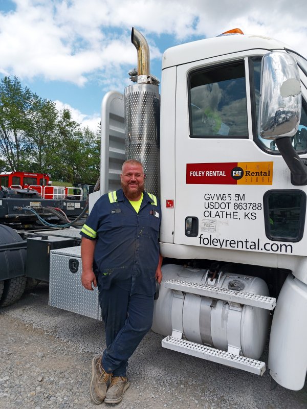 Tim Stone Next to Foley Rental Truck